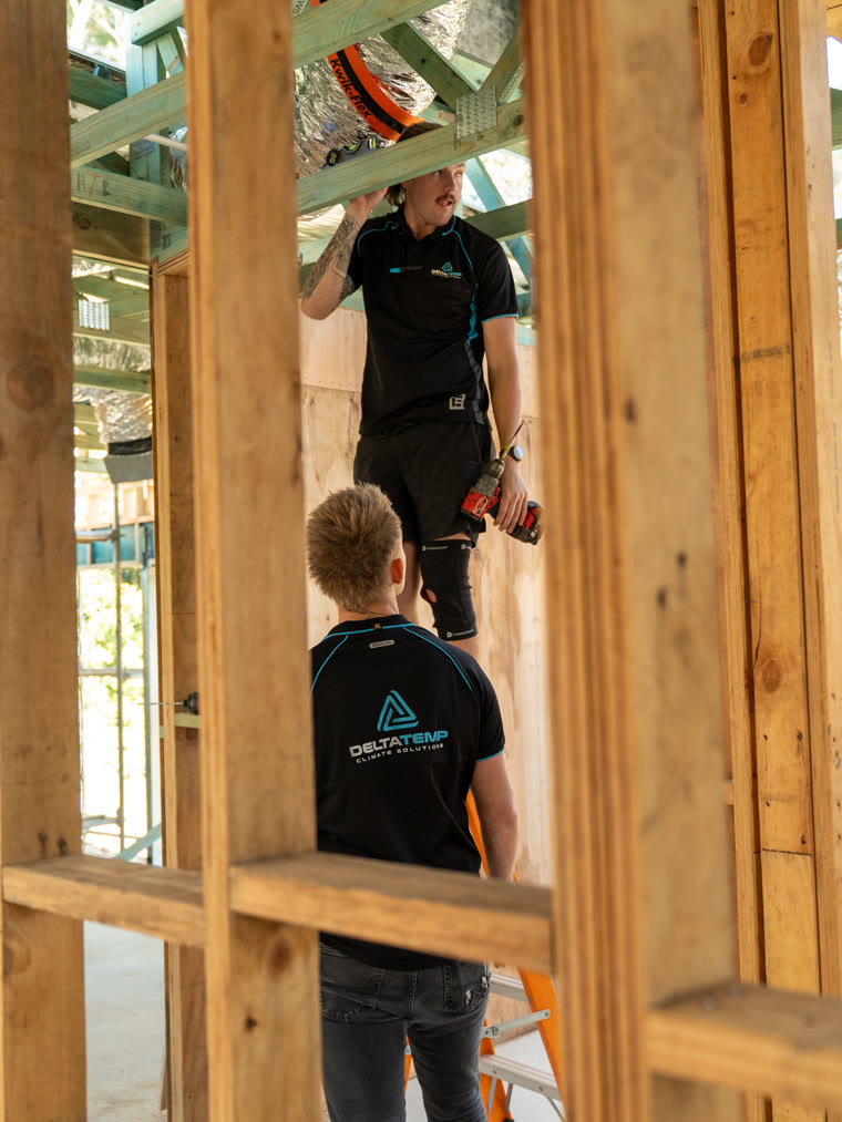 Delta Temp technicians working through the frame